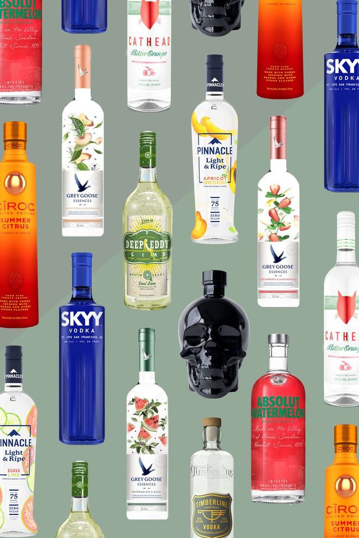 many different types of alcohol bottles on a green background with the same color as each one