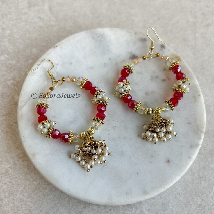 Gold Hoop earrings with faceted red beads and pearls with a small jhumka 2 inch wide x 1 inch length and light weight Ready to ship as seen with gift box! Red Hoop Earrings For Valentine's Day, Cheap Red Hoop Earrings With Colorful Beads, Red Jewelry Sets With Polished Round Beads, Red Hoop Earrings With Colorful Beads, Hand-strung Red Round Bead Jewelry, Pink Earrings, Red Bead, Gold Hoop, Gold Hoop Earrings