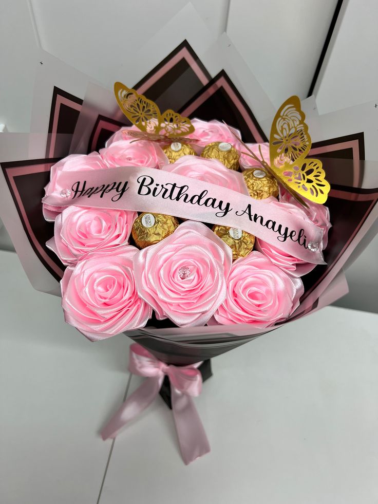 a bouquet of pink roses with a happy birthday message