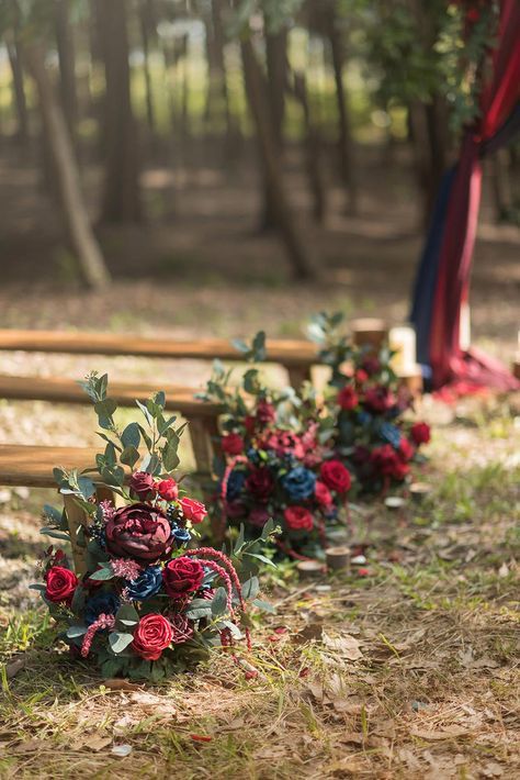 the flowers are laying on the ground next to the benches in the woods and trees