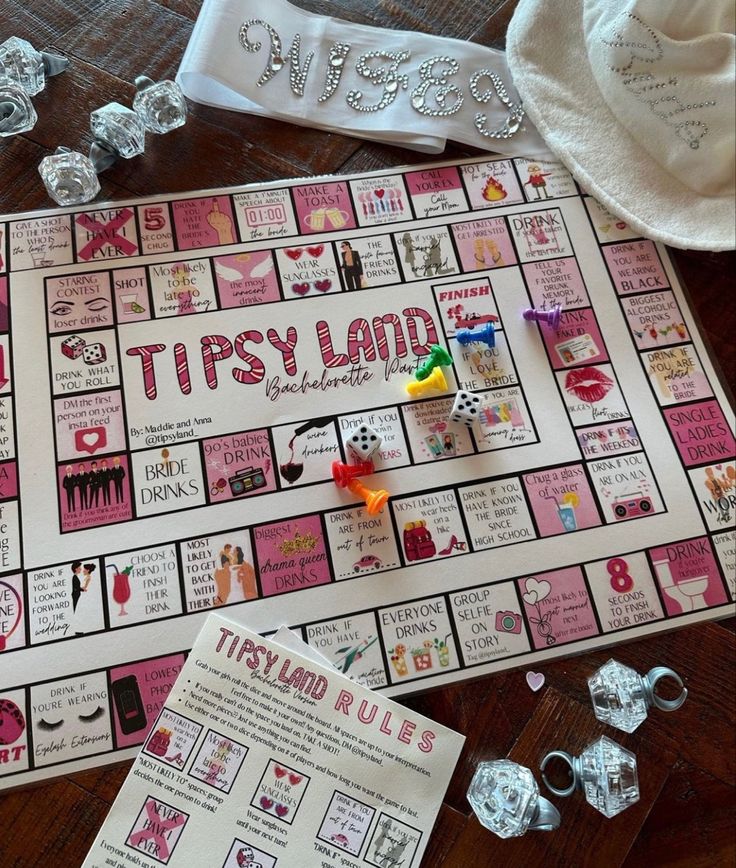 a board game with dices and candy on the table