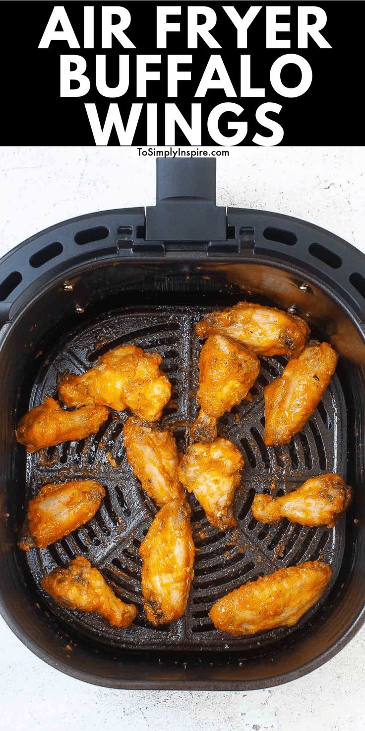 air fryer buffalo wings cooking in an air fryer