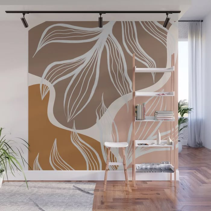 an abstract wall mural with leaves in brown, white and beige colors on a wooden floor