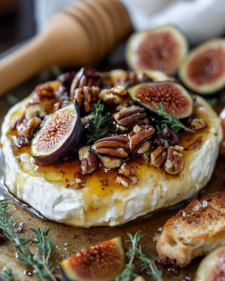 figs and cheese on a wooden board with bread