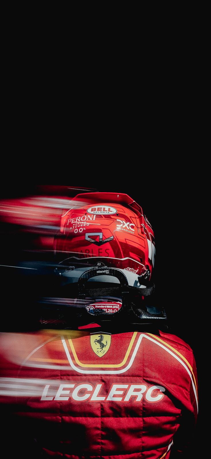 three suitcases stacked on top of each other in front of a black background with red lettering