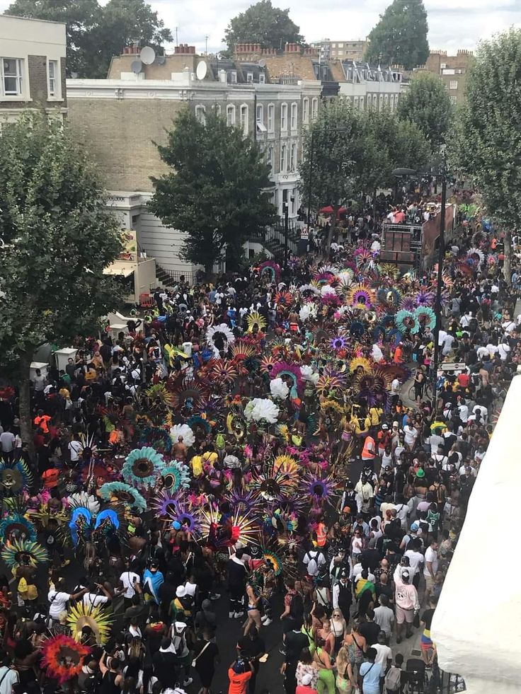 a large group of people standing around each other