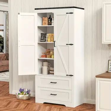 an armoire with doors and drawers in a living room