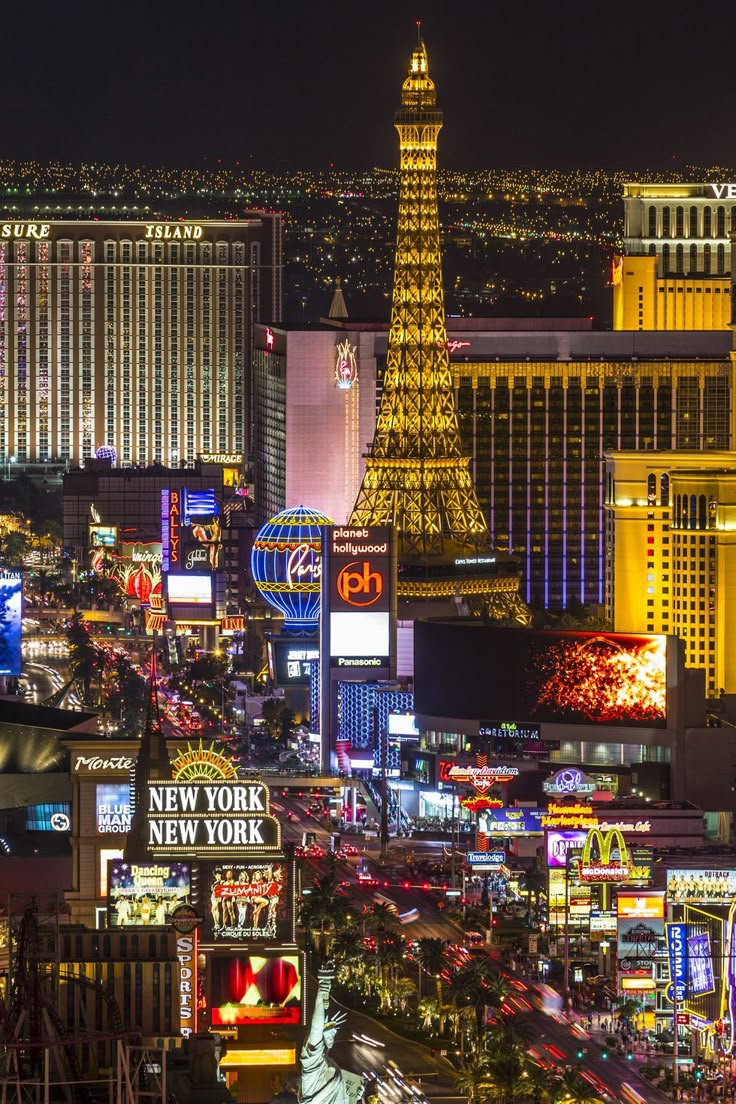 las vegas at night with the eiffel tower in the background stock photo getty images