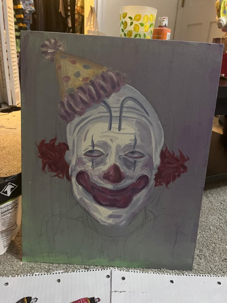 a painting of a clown with a party hat on it's head is shown