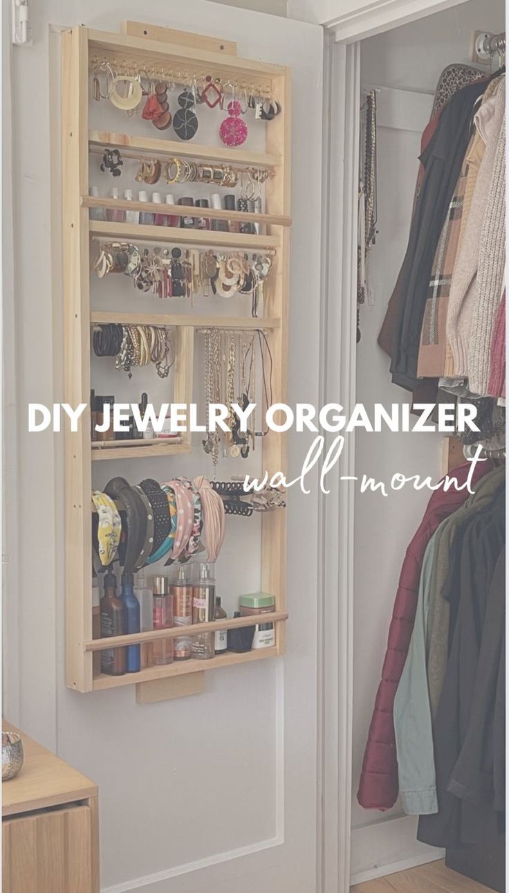 an organized closet with jewelry and bracelets hanging on the wall, next to a door