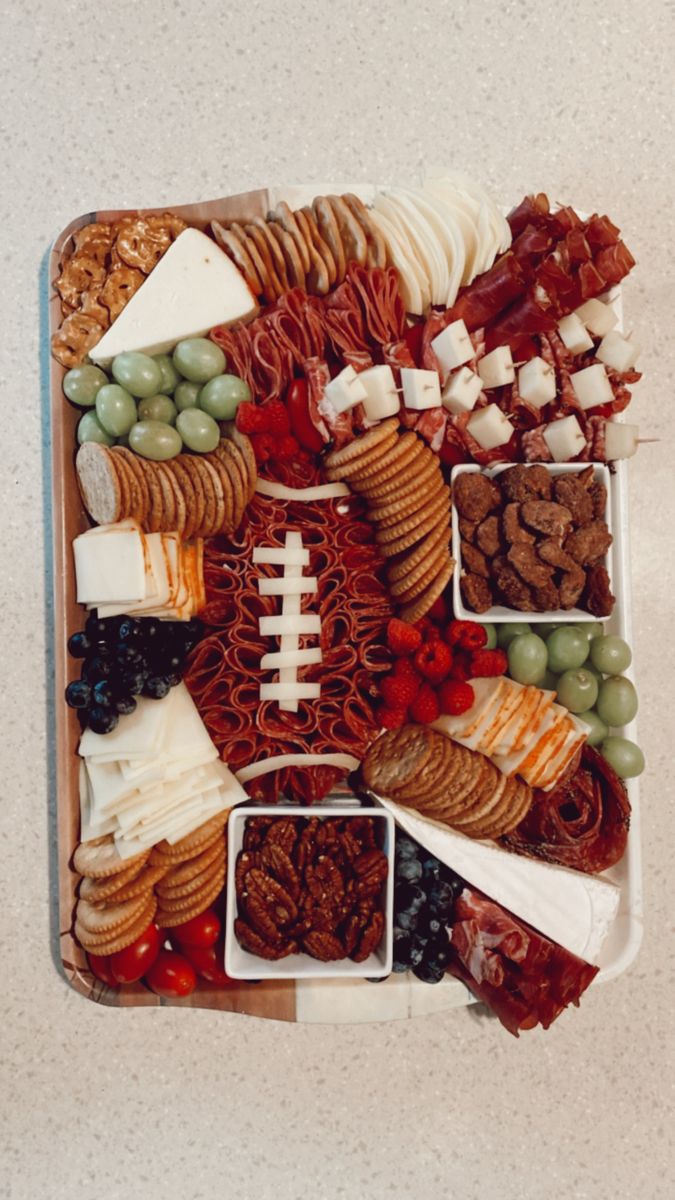 a football themed platter filled with snacks