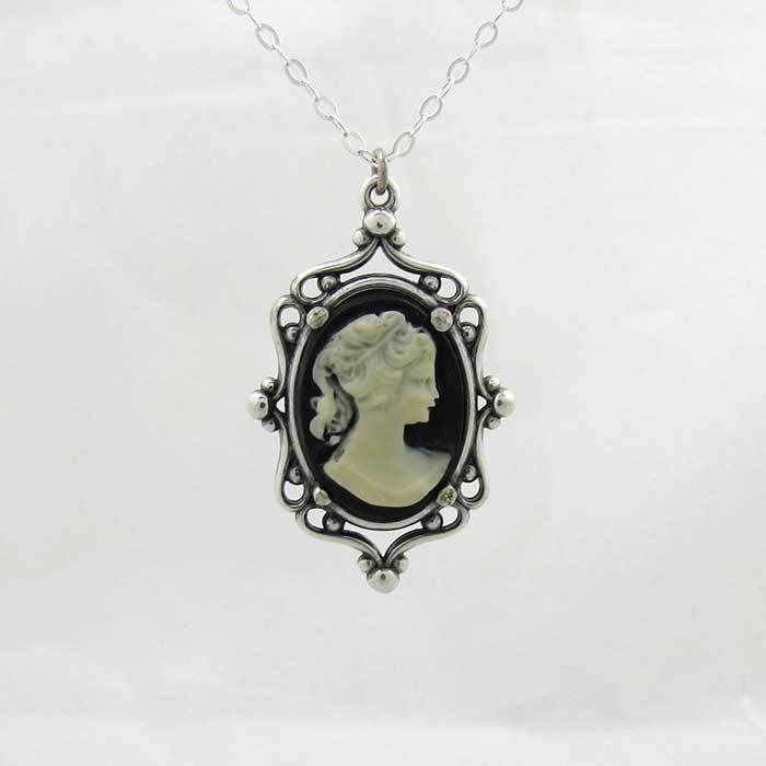 This classic Victorian style pendant is a 20 mm x 30 mm sterling silver setting with a 18 mm x 13 mm resin cameo, aged to resemble an heirloom piece. This perfectly matches my cameo ring and is a beautiful gift given as a set. Each necklace comes with a 16 inch silver chain. If you require a longer chain, please include this information at checkout. Due to the handmade nature of the creation, each piece may have slight variations. All items come with free resize and maintenance for the life of t Classic Oval Pendant Jewelry Collectible, Classic Handmade Oval Cabochon Jewelry, Handmade Classic Oval Cabochon Jewelry, Victorian Cameo Jewelry As Gift, Classic Antique Silver Handmade Jewelry, Classic Handmade Antique Silver Jewelry, Classic Oval Antique Silver Necklace, Elegant Antique Silver Jewelry For Memorial, Elegant Filigree Jewelry For Memorial