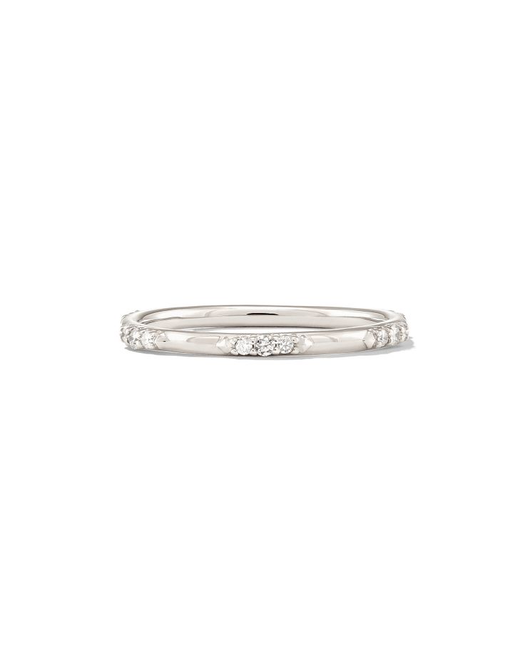 a white gold ring with three diamonds