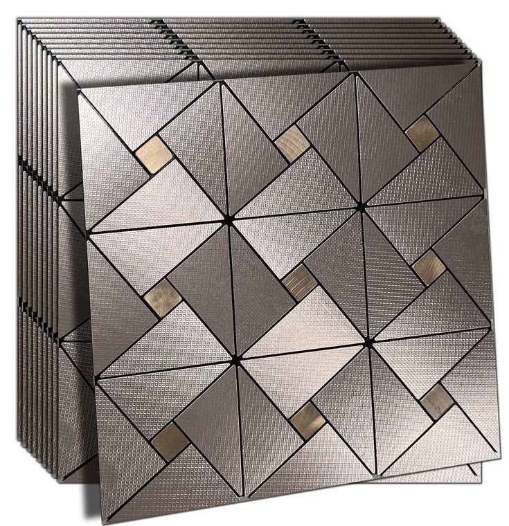 two silver boxes sitting next to each other on top of a white surface with squares and rectangles