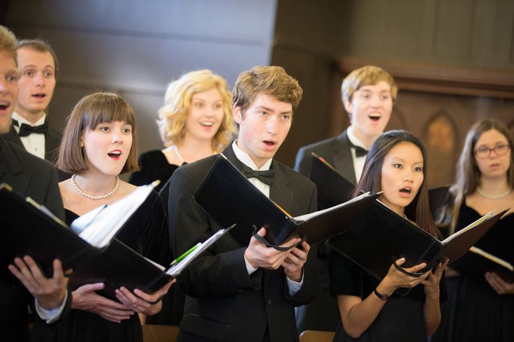 a group of young people singing in choir