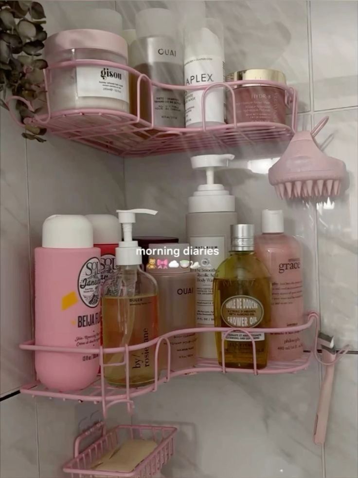 two pink shelves with soaps, lotions and other bathroom items