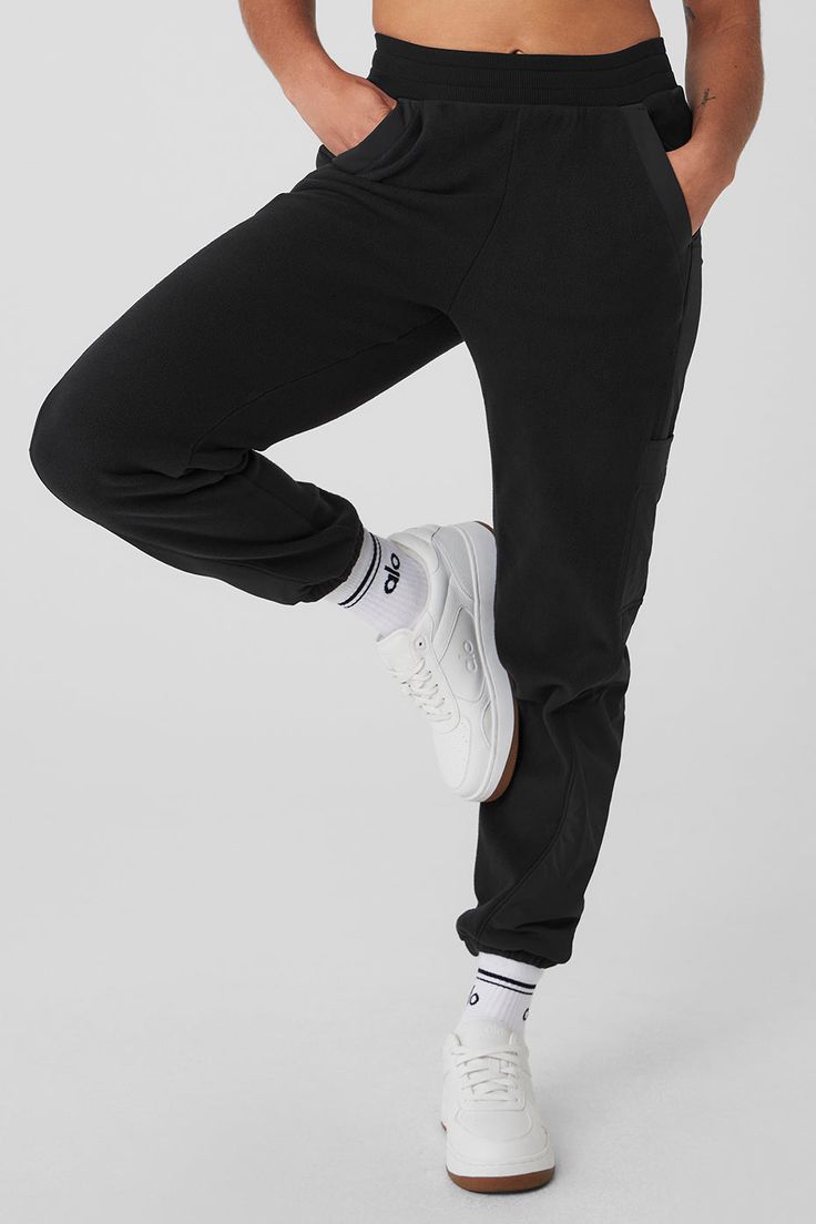 Made from a fleecy-soft fabric with smooth, contrasting panels down the legs, these pants are every bit as cozy as they look. They have a total of 4 pockets—2 on the sides, 2 on the legs—plus a stretchy high-rise waistband and stretchy cuffed hems for a jogger-style fit. Our advice? Get the matching jacket, too. Sporty Cotton Bottoms By Alo Yoga, Alo Yoga Relaxed Fit Sports Bottoms, Black Sweats With Pockets For Loungewear, Comfortable Black Sweats With Pockets, Cozy Joggers With Elastic Waistband For Streetwear, Alo Yoga Sporty Cotton Sweatpants, Alo Yoga Sporty Relaxed Fit Joggers, Alo Yoga Cotton Sporty Sweatpants, Alo Yoga Casual Straight Leg Bottoms