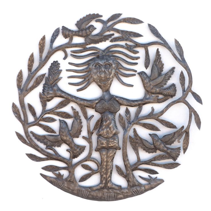 an intricately designed metal wall hanging with birds and leaves