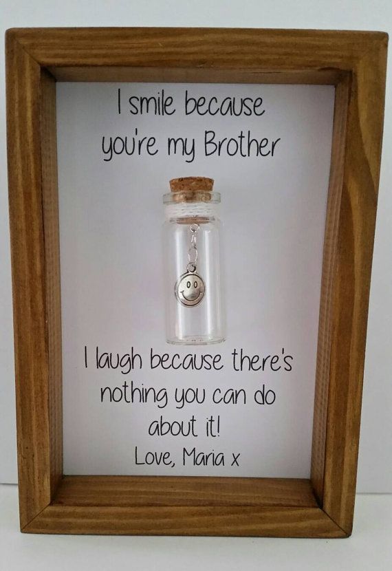 a message in a wooden frame that says i smile because you're my father