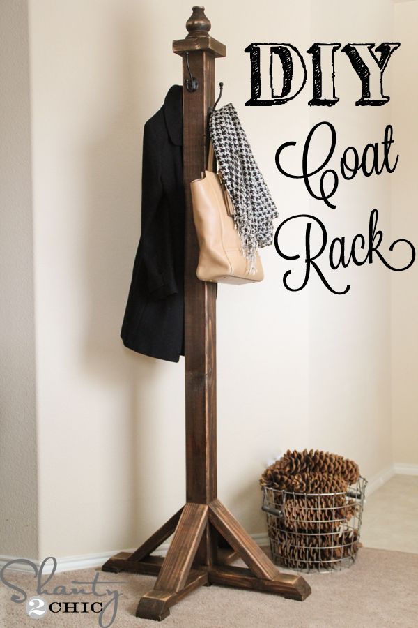 a coat rack with clothes hanging on it and the words diy coat rack above it