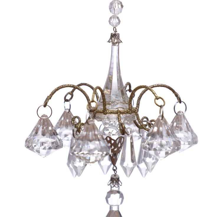 an antique chandelier with glass drops hanging from it