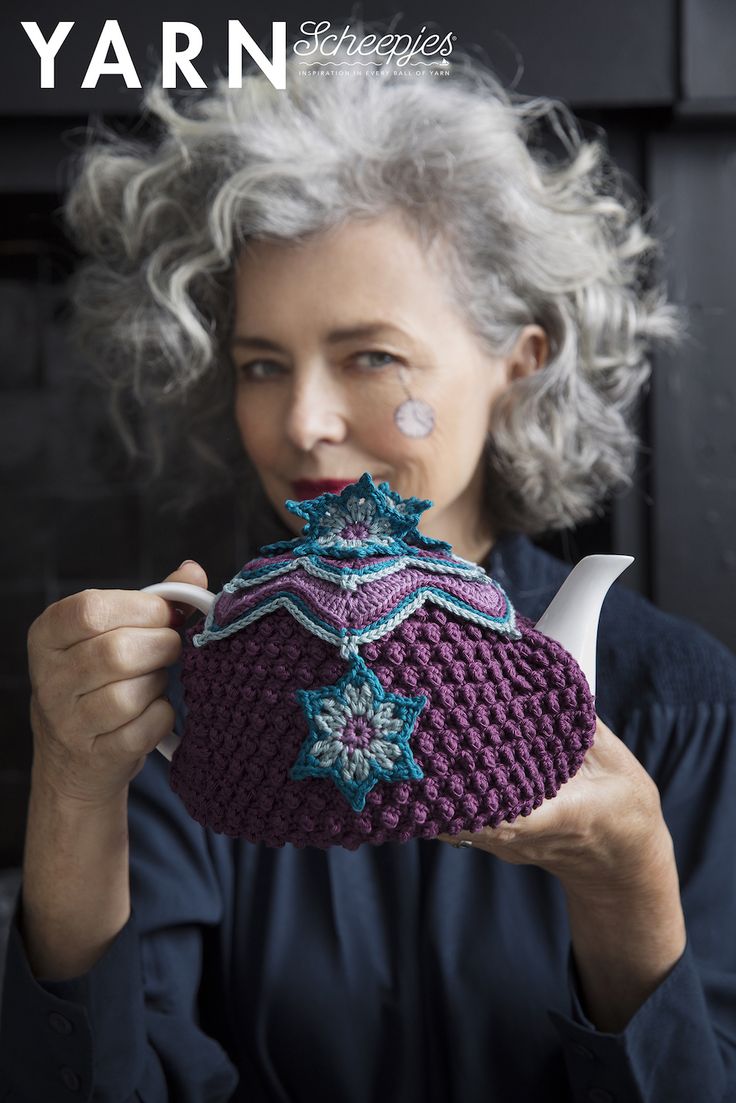 an older woman holding a tea pot in front of her face with the words yarn on it