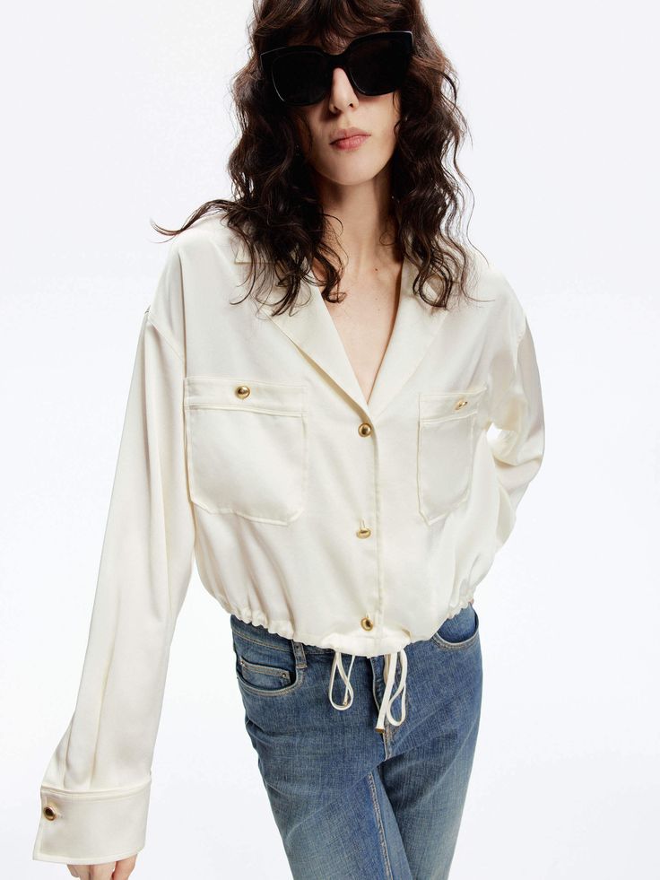 MO&Co. Women's Front Pocket Satin Shirt Made of a smooth and soft acetate blend, it features a drawstring hem for added detail. With a cropped cut, pair it with high-waisted jeans for a chic and trendy look. Features : - Cropped boxy silhouette- V-neckline, chest pocket and drawstring hem- Made with smooth and soft triacetate blend Code: MBD1SHT004The back length of size S is 49.5cmMATERIALS & CARE Material: 86.2% Triacetate 13.8% PolyesterPlease put it into a mesh bag to wash.REMINDER: All item Satin Shirt, Mesh Bag, High Waist Jeans, Dress Collection, Chest Pocket, Front Pocket, Black Shirt, Knitwear, Dress Up