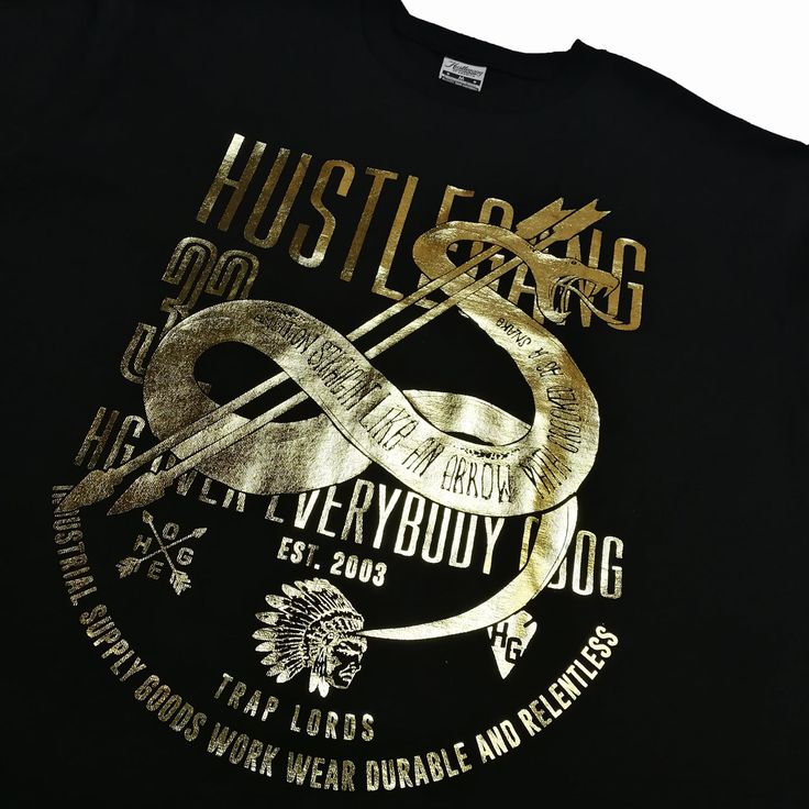 Hustle Gang Viper logo tee features premium 100% cotton crewneck t-shirt with gold foil logo screen-print at front. By Hustle Gang of America. Style: HG1810709 Gold Cotton Tops With Logo Print, Gold Crew Neck Top With Logo Print, Gold Crew Neck T-shirt With Letter Print, Gold Graphic Tee With Letter Print, Gold Graphic Tee With Short Sleeves, Casual Gold T-shirt With Logo Print, Gold Short Sleeve Graphic Tee, Gold Graphic Tee With Crew Neck, Gold Crew Neck Top With Screen Print