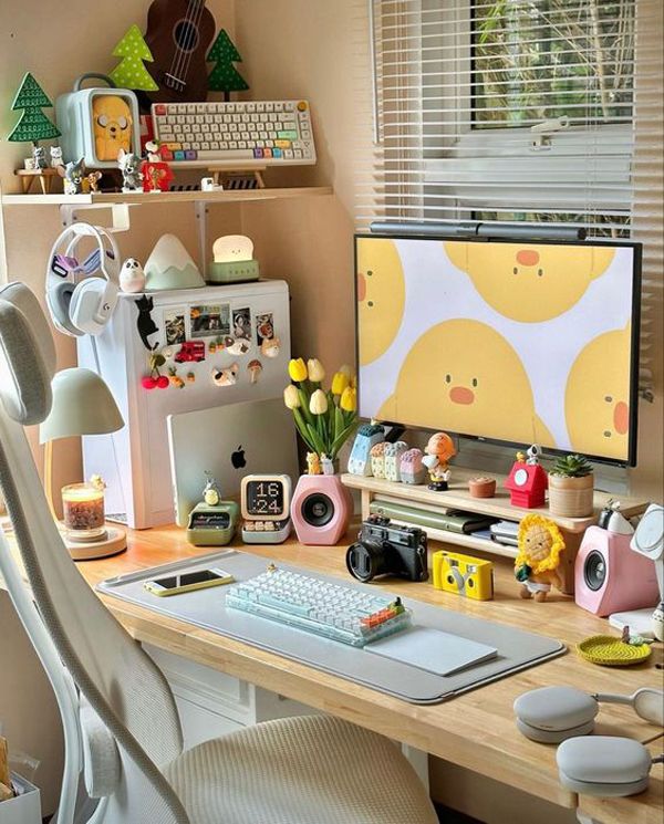 a desk with a computer monitor and keyboard