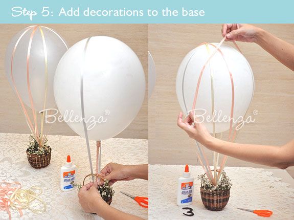 the balloon is being made into a vase with balloons attached to it, and then tied together