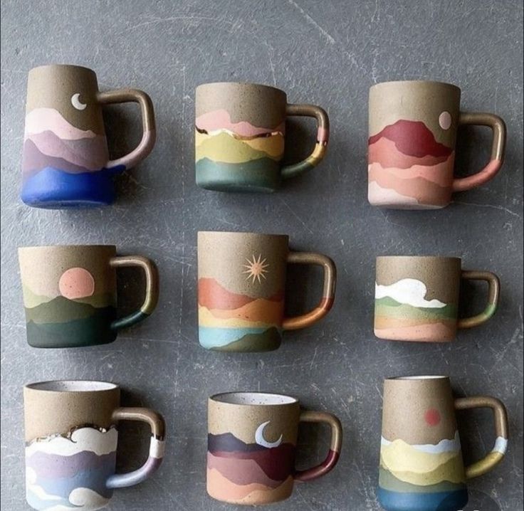 coffee cups with different designs on them sitting next to each other