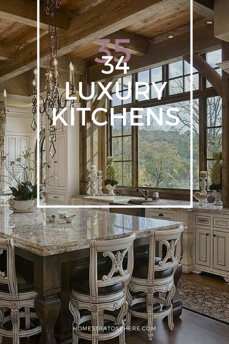 a large kitchen with an island and chandelier