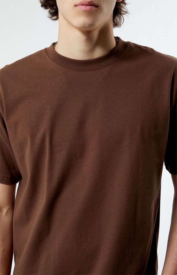 Experience comfort throughout the week with The PacSun Premium T-Shirt. Boasting a classic crew neckline, short sleeves, and a regular fit, its soft premium cotton fabrication ensures a luxurious feel that complements your daily style effortlessly.


	Crew neckline
	Short sleeves
	Regular fit
	50% Cotton, 50% polyester
	Machine washable
	Model is wearing size medium
	Model Measurements: 6'3” Height, 30" Waist, 39” Chest Casual Brown Crew Neck T-shirt, Brown Relaxed Fit T-shirt For Everyday Wear, Oversized Brown T-shirt, Brown Basic Relaxed Fit T-shirt, Brown Cotton Crew Neck T-shirt, Oversized Brown Cotton T-shirt, Brown Oversized Short Sleeve T-shirt, Basic Brown Cotton T-shirt, Classic Brown T-shirt For Summer