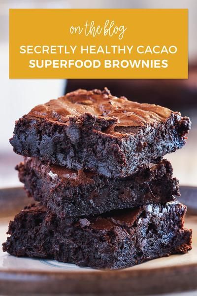 three chocolate brownies stacked on top of each other with the words secret healthy cacao superfod brownies