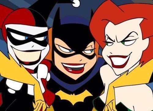 three cartoon characters are standing together in front of a dark background, one is wearing a batman mask and the other has red hair