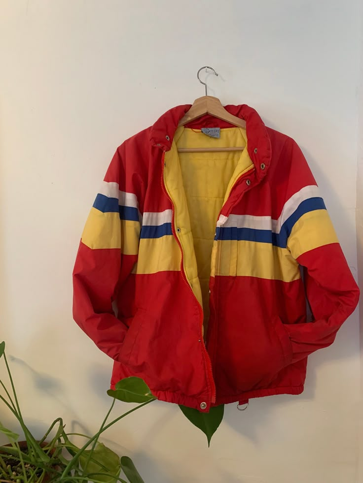 Vintage Sears red puffer jacket  Yellow blue stripe  4 pockets, key ring and small hidden hood (in collar)  mild wear (as shown) still fresh !  circa 1970 Size small-med Measurements (inches)  22 pit to pit 24 length 25 sleeve Red Retro Windbreaker With Pockets, Retro Red Windbreaker With Pockets, Retro Cotton Windbreaker With Pockets, Retro Red Hooded Outerwear, Retro Cotton Windbreaker For Outdoor, Vintage Striped Winter Outerwear, Red Retro Hooded Windbreaker, Retro Red Hooded Windbreaker, Retro Cotton Hooded Windbreaker