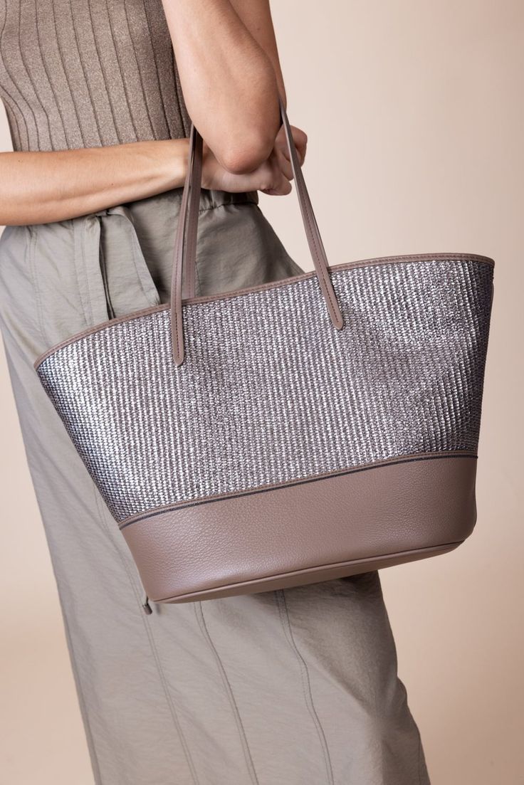 Brunello Cucinelli metallic raffia tote bag in platinum brown. Raffia, Brass Open top with magnetic closure, one zip pocket Approx. 20.5"H x 12.2"W x 7.1"D Fits Iphone 15 Pro Max Made in IT Raffia Tote Bag, Investment Bags, Marissa Collections, Work Wear Women, Open Top, Spring Collection, Brunello Cucinelli, Iphone 15 Pro, Magnetic Closure