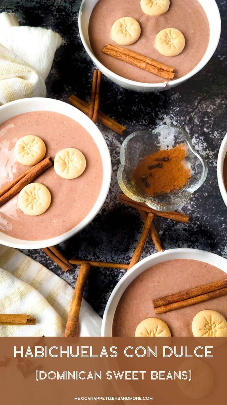 three bowls filled with pudding and cinnamons on top of a table next to some cinnamon sticks