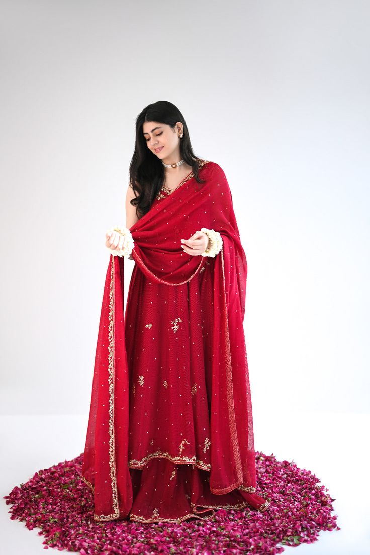 Designed on a beautiful tone of maroon in handloom cotton net, this panelled kalidaar features gold ada work of dabka naqshi, sequins and nug. An alluring three piece is paired with a heavily embellished dupatta and flappers. The length of the kalidaar is 46 inches. Order Duration: 4 to 6 weeks Boutique Dress Designs, Email Design, Designer Dresses, Boutique, Gold, Design