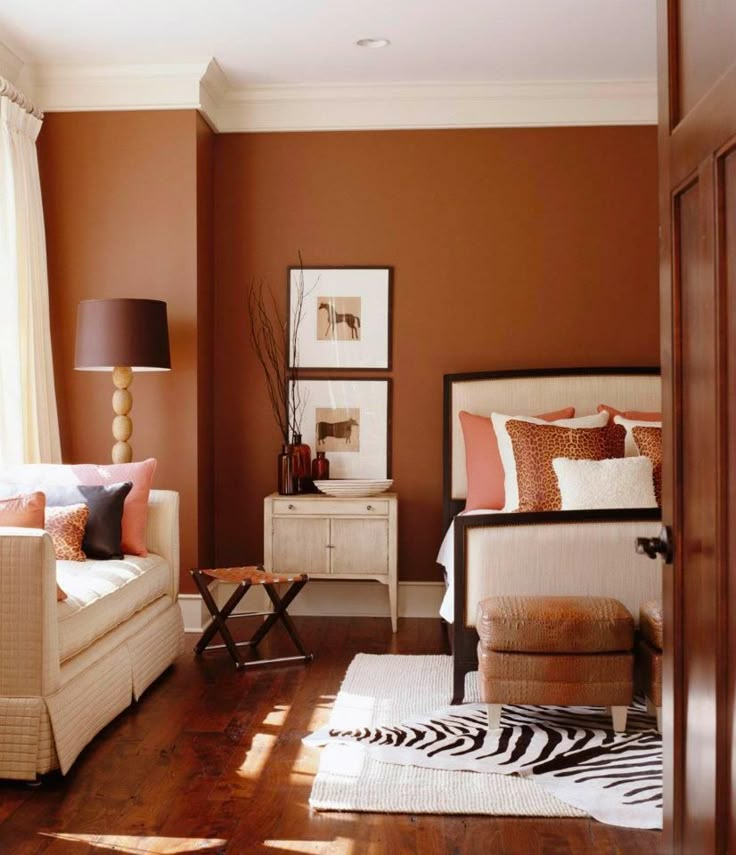 a living room with zebra print rugs on the floor and furniture in front of it