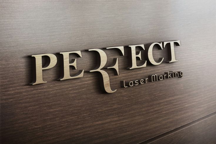 the name perfect laser marking on a wooden wall with metal lettering and wood grained finish