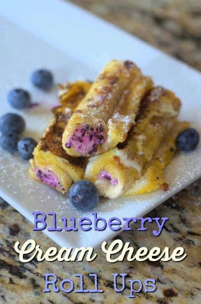 blueberry cream cheese roll ups on a white plate