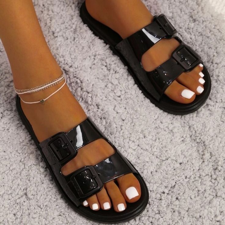 Never Worn Black Slide Sandals With Textured Footbed, Black Textured Footbed Slide Sandals, Black Round Toe Flip Flops, Black Jelly Sandals For Spring, Black Footbed Sandals With Buckle Closure For Spring, Black Closed Toe Footbed Sandals For Summer, Casual Black Footbed Sandals With Buckle Closure, Black Spring Footbed Sandals With Buckle, Black Open Toe Jelly Sandals For Spring