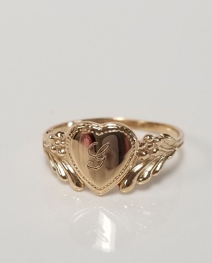 "Thanks for shopping our vintage estate store. We tend to sell well below wholesale and truly hope you enjoy all of our items. Many of the items are one of a kind, so please enjoy scrolling through the pictures and hopefully something will catch your eye. Brown spots are from camera or reflections. Estate 10k yellow gold monogram capital G cursive heart ring. Custom made ring for our shop. Ring size: 3 Setting: 7.5mm 1/4\" to 3/8\" Band width: 1.4mm Weight: .90 gram Marked 10k and it's sweet. On G Initial Ring, G Cursive, Cursive G, J Ring, G Initial, G Ring, Antique Style Rings, Custom Wedding Band, Gold Monogram