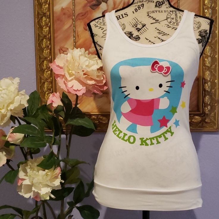 Adorable Hello Kitty Sleepwear Playful White Sleeveless Sleepwear, Cute White Sleepwear With Character Print, Cute White Character Print Sleepwear, Casual White Sleepwear With Character Print, Playful Hello Kitty Print Sleepwear, White Cartoon Print Sleep Top, Casual Character Print Tops For Pajama Party, Casual Tops With Character Print For Pajama Party, White Cotton Hello Kitty Sleepwear