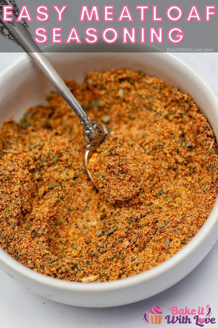 a white bowl filled with seasoning next to a spoon