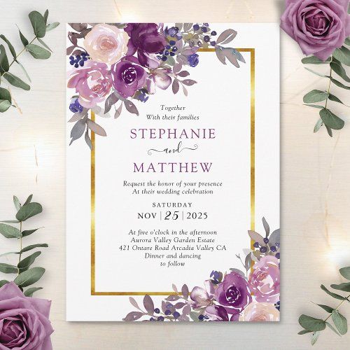 a wedding card with purple flowers and greenery on the front, in gold frame