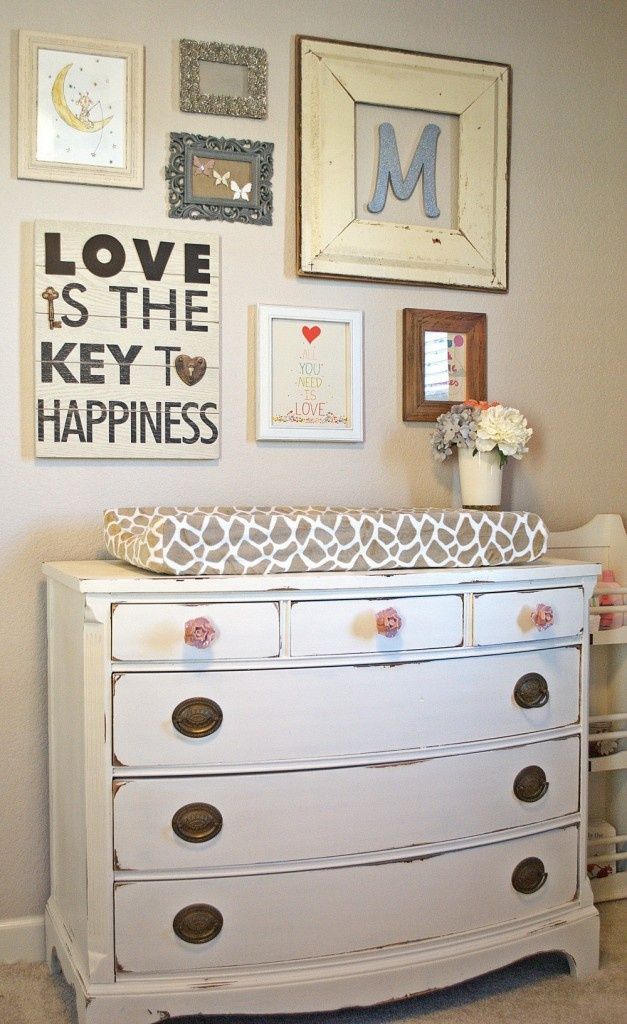 an old dresser has been transformed into a baby's nursery crib with the words, dressed up dresser love is the key to happiness