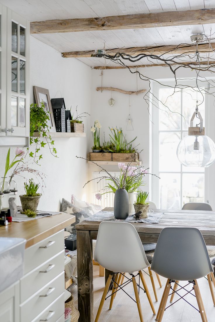 a living room filled with lots of furniture and decor on top of a wooden table