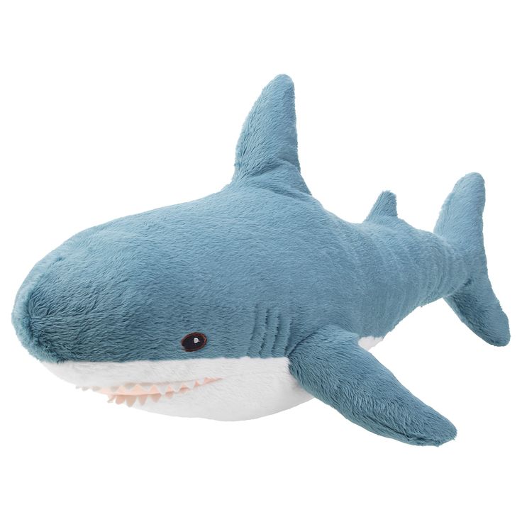 a stuffed shark is shown on a white background